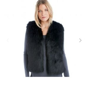 Soft black faux fur vest fits like a medium